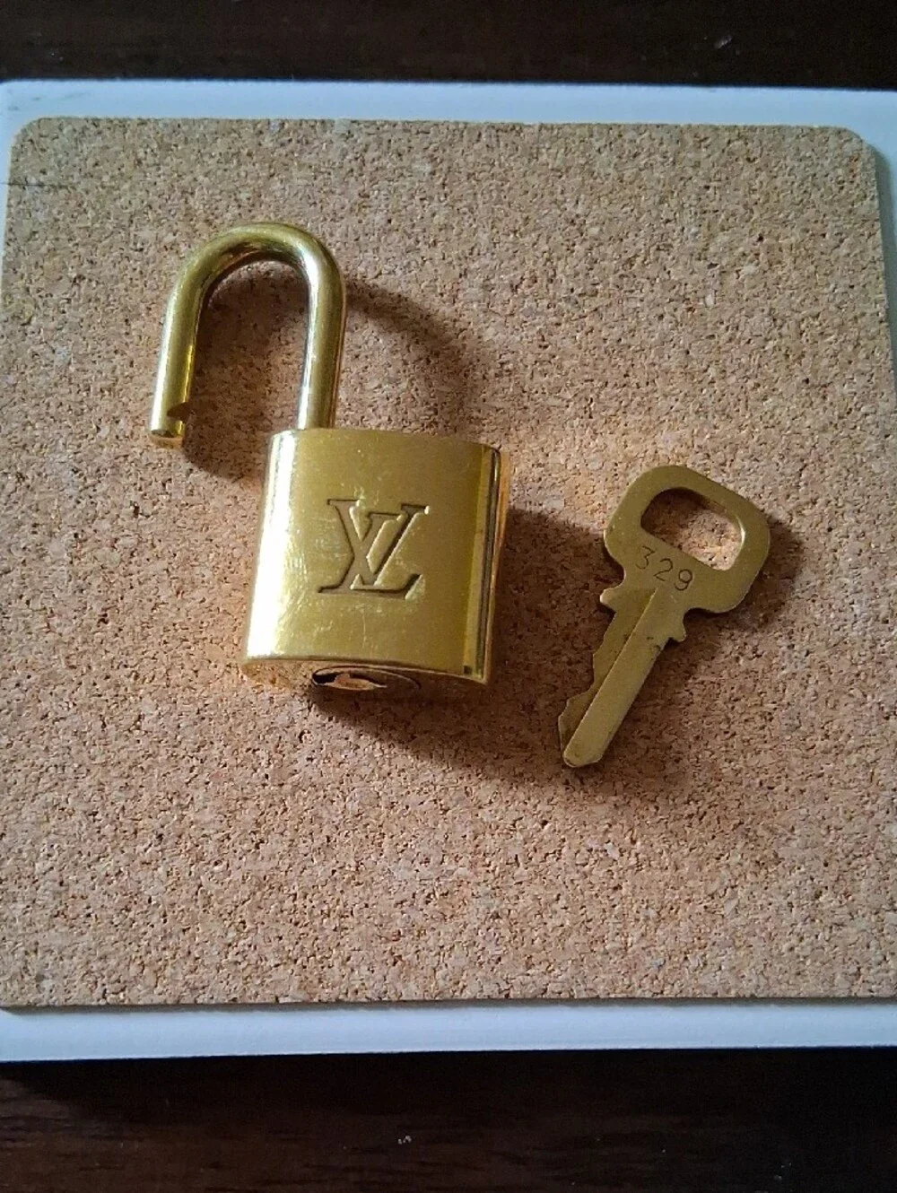 Louis Vuitton Gold Padlock and Key Set Shiny And NEW